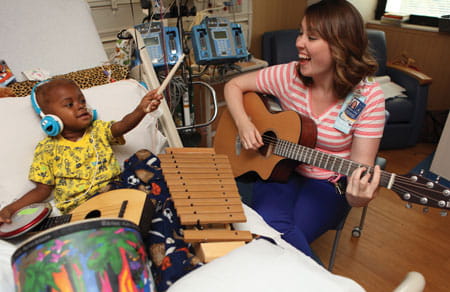 Music therapy in a patient's room.